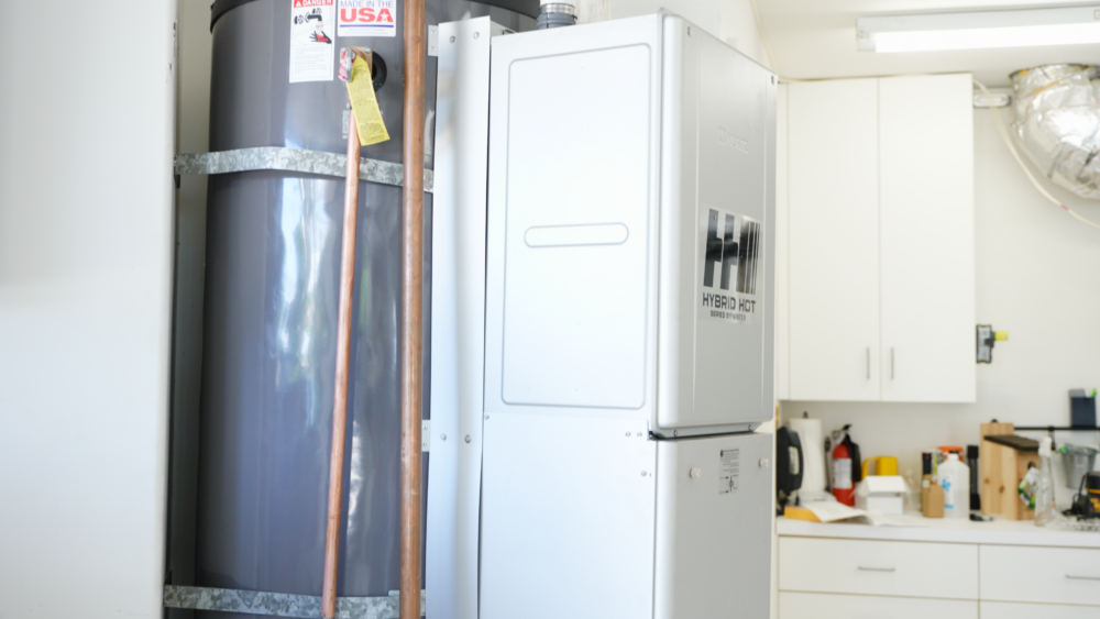 The image shows a side profile of the Noritz Hybrid Hot water heater.