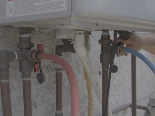 The image shows Isolation valves connecting to draining flexible pipes.