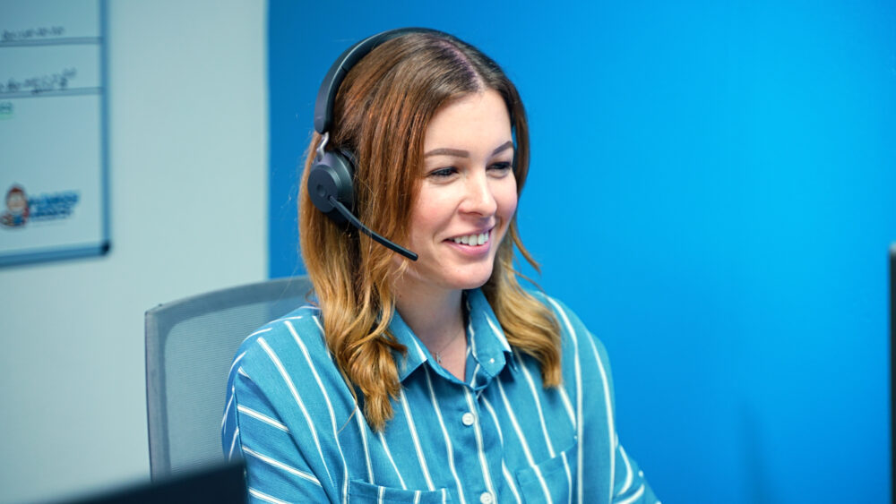 A Monkey Wrench call center representative taking a call from a homeowner.