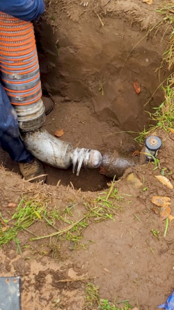 A main sewer line being serviced by a technician.