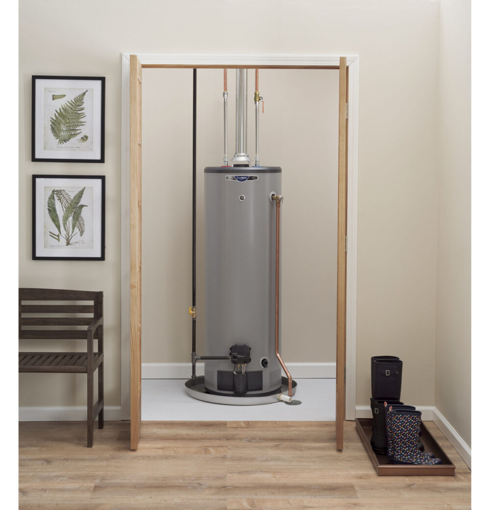 A GE tank-style water heater inside a home. 