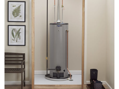 A GE tank-style water heater inside a home.