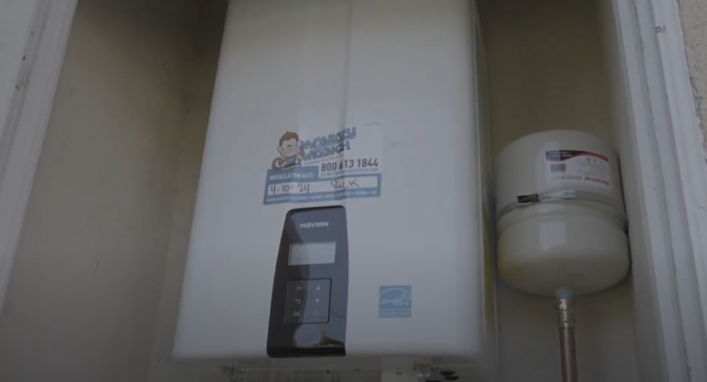 A Navien tankless water heater install with a Monkey Wrench sticker from Rick.