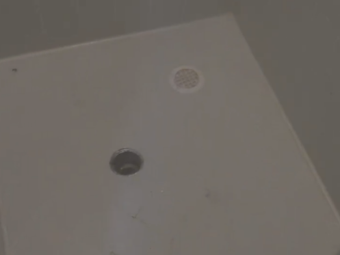 The image shows a shower drain.